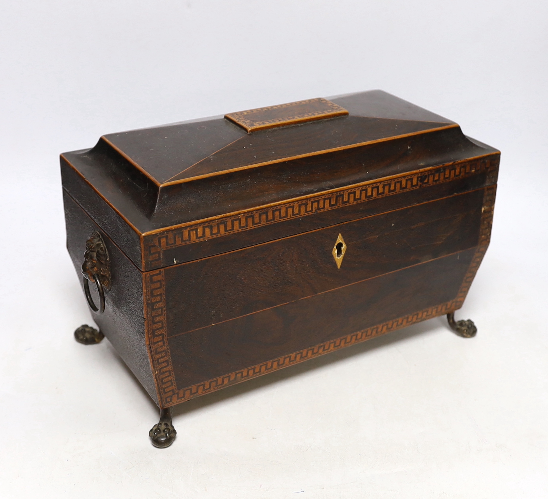 A Regency inlaid rosewood tea caddy, with two canisters, gilt brass handles and claw feet, 20cm high